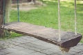 Old wooden swing in the garden Royalty Free Stock Photo