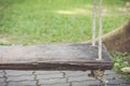 Old wooden swing in the garden Royalty Free Stock Photo