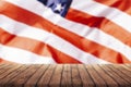 Old wooden table for advertising goods on the background of the American flag, a template for the infographic of trade in the Royalty Free Stock Photo