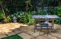 Old wooden table and black steel chair for outdoor gardens Royalty Free Stock Photo