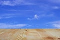 Old wooden table and empty front and blue sky background, Empty space place a product,  texture with natural wood pattern for Royalty Free Stock Photo