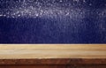 old wooden table in front of glitter lights background Royalty Free Stock Photo