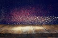 old wooden table in front of glitter lights background Royalty Free Stock Photo