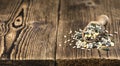 Old wooden table with mixed Seeds (selective focus) Royalty Free Stock Photo
