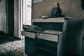 An old wooden table stands in the corridor of an abandoned hospital. Shabby and dirty walls. Royalty Free Stock Photo