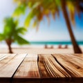 Old wooden table top on blurred beach background with coconut palm leaf. Concept Vacation, Summer, Beach, Sea Royalty Free Stock Photo