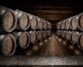 Old wooden table top and oak wine barrels at the background Royalty Free Stock Photo