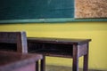 Old wooden tables and chairs in classroom. Royalty Free Stock Photo