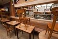 Old wooden tables in old restaurant with vintage decor, retro furniture inside