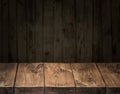 Old wooden tabletop and wooden wall at the background Royalty Free Stock Photo