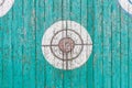 Old wooden target on the fence