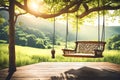 Old wooden terrace with wicker swing hang on the tree with blurry nature backgroun