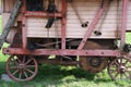 Old wooden threshing machine with flywheel and belt drive Royalty Free Stock Photo