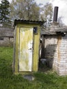 Old wooden toilet in a rustic manor. Royalty Free Stock Photo