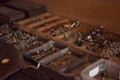 Old wooden toolbox with iron nails, screws, bolts and nuts. Storage of construction supplies in workshop. Male work box. Royalty Free Stock Photo