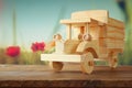 Old wooden toy car over wooden table. nostalgia and simplicity concept. vintage style image