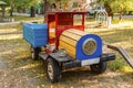 Old wooden toy car in the playground for children. Royalty Free Stock Photo