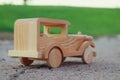 old wooden toy car on the road outdoors in the park Royalty Free Stock Photo