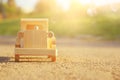 old wooden toy car on the road outdoors in the park at sunset Royalty Free Stock Photo