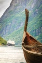 Old viking boat and ferryboat in norwegian fjord Royalty Free Stock Photo