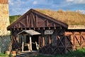 old wooden viking\'s house with moss on the roof