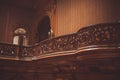 Old wooden vintage railing indoors. luxury carved wood interior in the hall of an aristocratic palace. rare architecture. copy