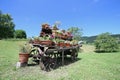 old wooden wagon decorated with many pots Royalty Free Stock Photo