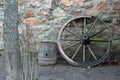 Old wooden wagon wheel and barrel Royalty Free Stock Photo