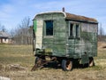 Old wooden wagon with wheels in sunny spring day Royalty Free Stock Photo