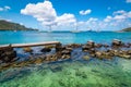 Old wooden walkway over the water to the beach in Bequia. Royalty Free Stock Photo