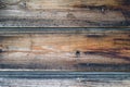 Old wooden wall with rusty nails, dark brown texture Royalty Free Stock Photo