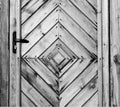 Old wooden wall texture or background with copy space. boards diagonally in a diamond shape. Detail of the door.