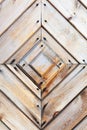 Old wooden wall texture or background with copy space. boards diagonally in a diamond shape. Detail of the door.