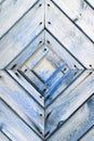 Old wooden wall texture or background with copy space. boards diagonally in a diamond shape. Detail of the door.