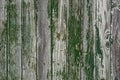 Old wooden wall with worn out green peeling paint Royalty Free Stock Photo