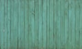 The old wooden walls painted green. Old wooden wall background or texture