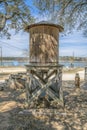 Old wooden water storage tank against scenic view of Lake Austin in Texas Royalty Free Stock Photo