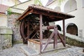 Old wooden water well with pulley and bucket. Palanok castle Royalty Free Stock Photo