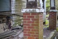 Old wooden weathered dilapidated abandoned two story house brick column Royalty Free Stock Photo