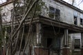 Old wooden weathered dilapidated abandoned two story house distant view Royalty Free Stock Photo