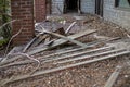 Old wooden weathered dilapidated abandoned two story house scattered waste Royalty Free Stock Photo