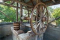 Old wooden well with large wheel