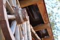 Old wooden wheel of the cart as a decoration for the room Royalty Free Stock Photo