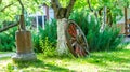 Old wooden wheel in the garden Royalty Free Stock Photo