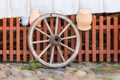 Old wooden wheel near wooden fence - Lithuania Royalty Free Stock Photo