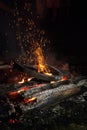 Old wooden wheel in ritual bonfire, fire sparks, Royalty Free Stock Photo