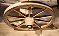 Old wooden wheels from grandfather`s cart are stored in a rustic barn Royalty Free Stock Photo