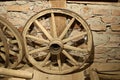 Old wooden wheels from grandfather`s cart are stored in a rustic barn Royalty Free Stock Photo