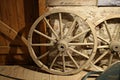 Old wooden wheels from grandfather`s cart are stored in a rustic barn Royalty Free Stock Photo