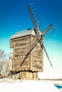 Old wooden windmill close up in winter Royalty Free Stock Photo